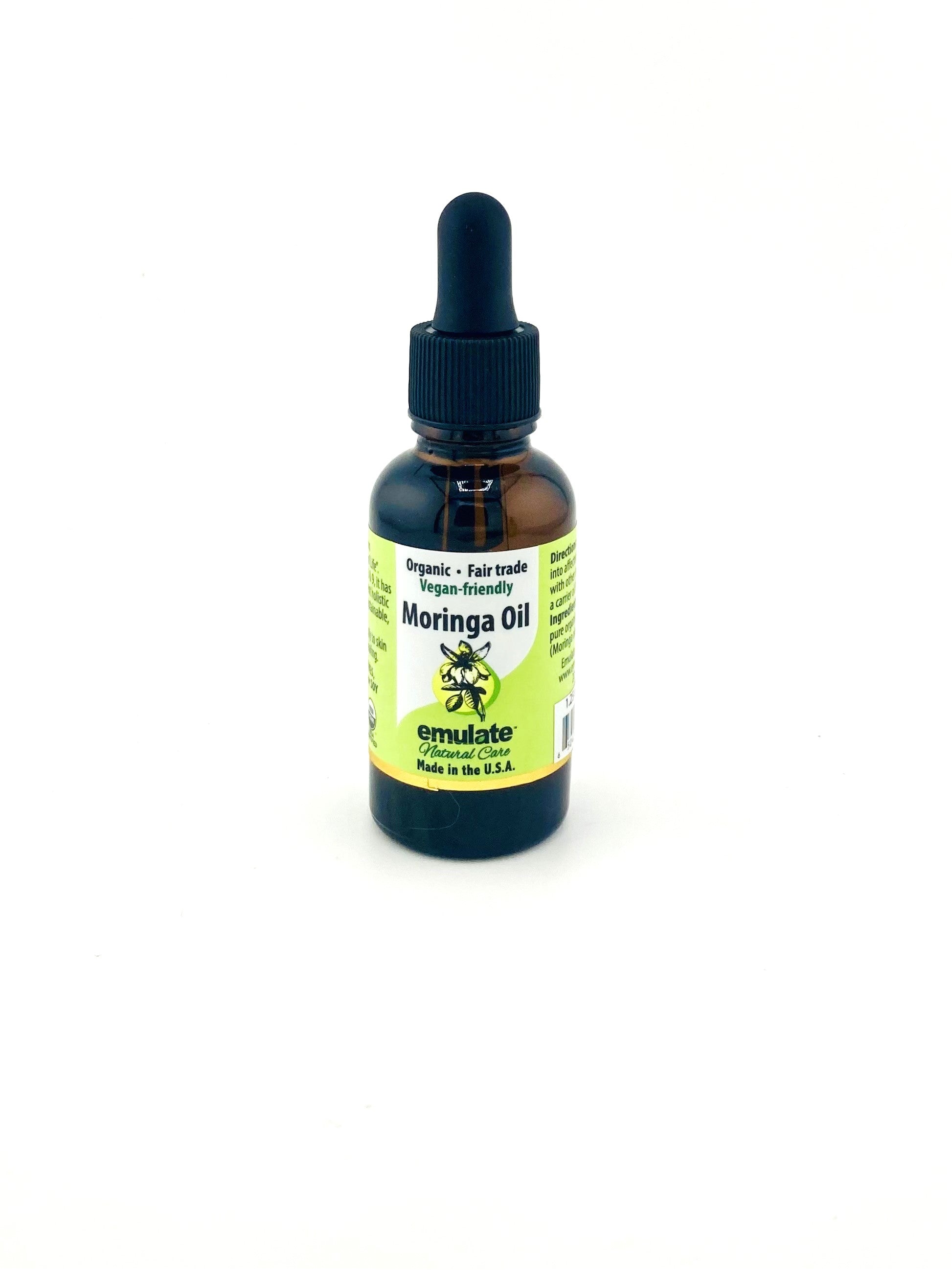 Bottle of Moringa Oil with a dropper on a white background