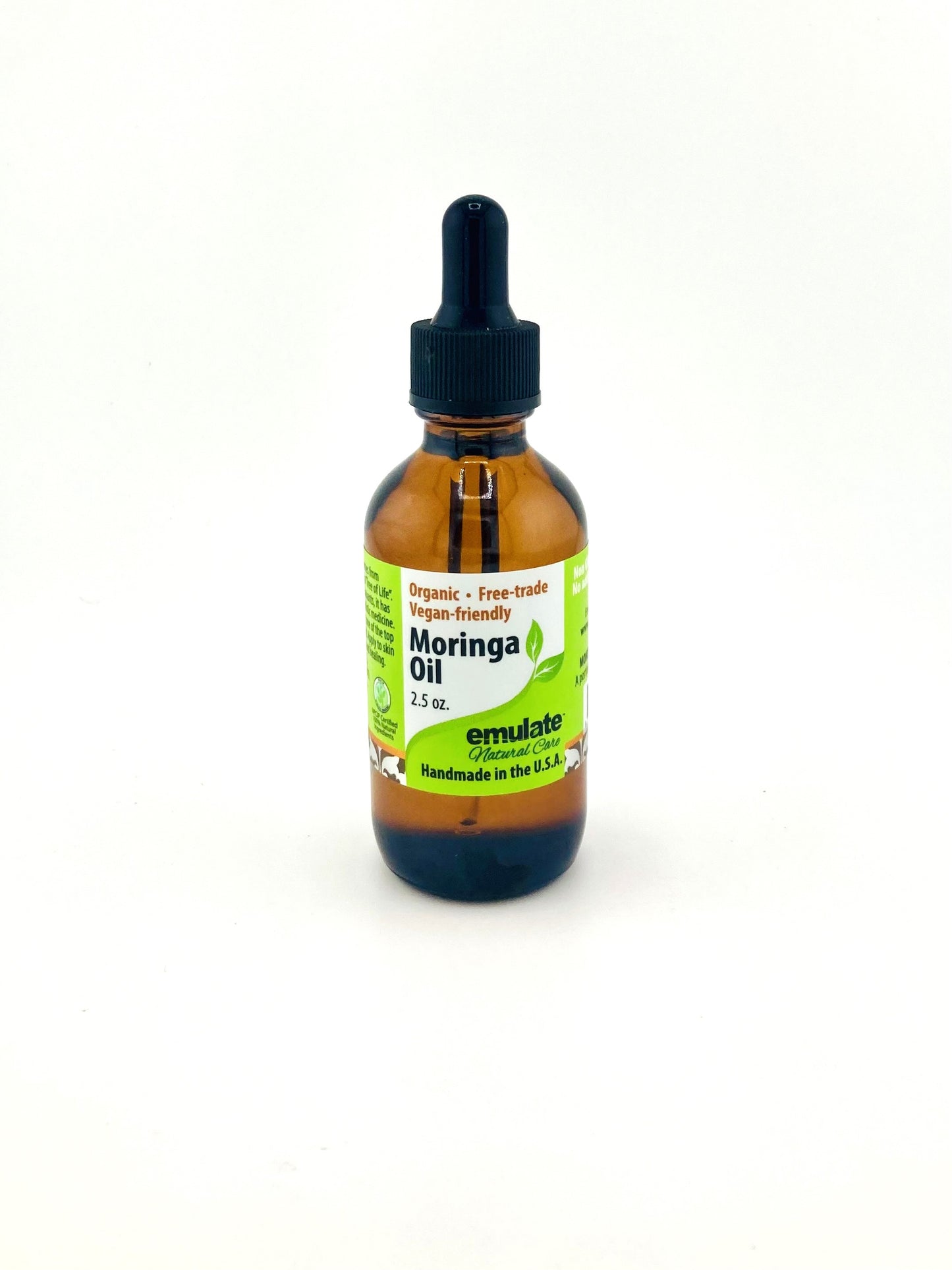 Bottle of Moringa oil with a dropper on a white background