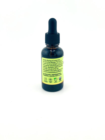 Bottle with dropper labeled 'Moringa' on a white background